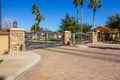 Double Access Gates With Large Palm Trees