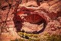 Double Arch - close-wet pair of natural arches in Arches National Park in Utah USA - tourist wandering around inside show scale Royalty Free Stock Photo