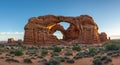 Double Arch Rock Formation at Sunset in Desert Landscape Royalty Free Stock Photo
