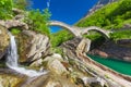 Double arch stone bridge at Ponte dei Salti with waterfall, Lavertezzo, Verzascatal, Ticino, Switzerland