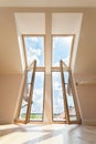 Double balcony window in the attic Royalty Free Stock Photo