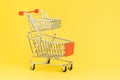 Double baskets shopping cart or shopping trolley on yellow background using as online shopping, e-commerce, supermarket consumer Royalty Free Stock Photo