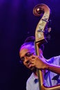 Double bass player Corcoran Holt of Kenny Garrett group plays his touble bass on stage during performance on OpenJazzFest summer j