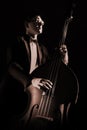 Double bass player playing contrabass Royalty Free Stock Photo
