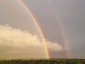 Double rainbow sunset Royalty Free Stock Photo