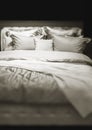 The double bed with bedclothes in dark Royalty Free Stock Photo