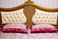 Double bed with decorative headboard Royalty Free Stock Photo