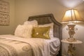 Double bed with fluffy pillows against the upholstered belgrave headboard