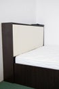 Double bed with lifting mechanism and mattress. The white mattress. Large bright bed Royalty Free Stock Photo