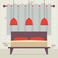 Double Bed With Red Ceiling Lamps In Front Of Brick Wall