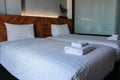 Double bed with white bed sheet and pillow in luxury room