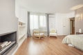 Double bedroom decorated with wallpaper, wooden rocking chairs Royalty Free Stock Photo