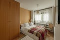 Double bedroom with light cherry wardrobe, bed