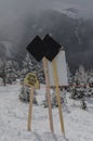 Double black diamond sign at ski resort with snow covered evergreens Royalty Free Stock Photo