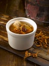 Double-boiled Cordyceps Flower with Chicken Soup served in a bowl isolated on table side view