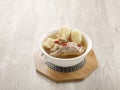 Double-boiled Spare Rib Soup with Chinese Yam and Snow Pear with chopsticks served in a dish isolated on mat side view on grey