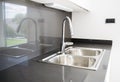 A double bowl stainless steel kitchen sink in a modern design