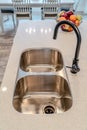 Double bowl undermount stainless steel sink with gooseneck faucet inside kitchen