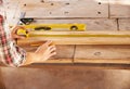 Double checking his measurements. A handyman getting his measurements just perfect with a spirit level and measuring Royalty Free Stock Photo