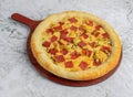 Double Cheese pizza Stuff Crust whole pizza tray on marble background