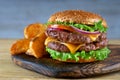 Double cheeseburger with fried potatoes Royalty Free Stock Photo