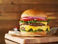 Double cheeseburger with lettuce, tomato, onion, and melted american cheese Royalty Free Stock Photo