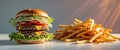 Double cheeseburger stacked high with fresh ingredients and a side of fries. Royalty Free Stock Photo