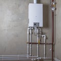 Double-circuit gas boiler in a new house for winter heating and water heating Royalty Free Stock Photo