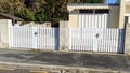 Double classic white aluminum home gate portal of suburbs house door in city Royalty Free Stock Photo