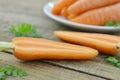 Double cut carrots on wooden table rustic Royalty Free Stock Photo