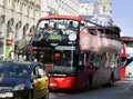 Double-deck bus with open roof and observation deck for tourists