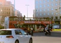 Double-deck bus with open roof and observation deck for tourists