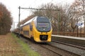 Double decker intercity DD VIRM between Arnhem and Utrecht at station Veenendaal-De Klomp in the Netherlands.