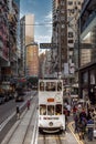 Double-decker tram on a busy street of the Hong Kong Island in China