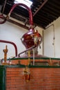 Double distillation process of cognac spirit in Charentias copper still pots and boilers in distillery in Cognac white wine region