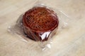 Double egg yolk mooncake wrapped in plastic Royalty Free Stock Photo