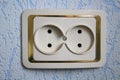 Double electrical outlet on a blue wall Royalty Free Stock Photo