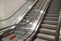 Double escalator staircase of a shopping mall, leading up and down from the basement