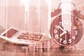 Double exposure of alarm clock and step of coins stacks with fin