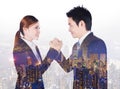 double exposure of arm wrestling between businessman and businesswoman with city background Royalty Free Stock Photo