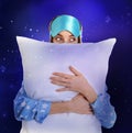 Double exposure of beautiful woman with pillow and night sky. Bedtime