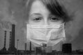 Double exposure, black and white image. Teenager girl in a protective mask and industrial exhaust pipes with smoke. Royalty Free Stock Photo