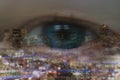 Double exposure of business concept, business eye man look trough the cityscape or landscape in the city with bokeh light