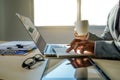 Double exposure of business man hand working on laptop computer on wooden desk with social media network diagram Royalty Free Stock Photo