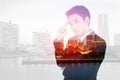 Double exposure of business man thinking against city Royalty Free Stock Photo