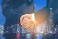 Double exposure of business people handshake with city night background. successful of the deal, partnership, teamwork concept Royalty Free Stock Photo