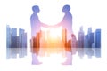Double exposure business people shaking hands over a cityscape background Royalty Free Stock Photo