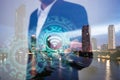 Double exposure of business, technology and internet connection concept. Businessman using icon wifi on hand and modern city