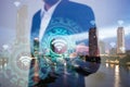 Double exposure of business, technology and internet connection concept. Businessman using icon wifi on hand and modern city