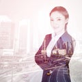 Double exposure of business woman crossed arms with city backgr Royalty Free Stock Photo